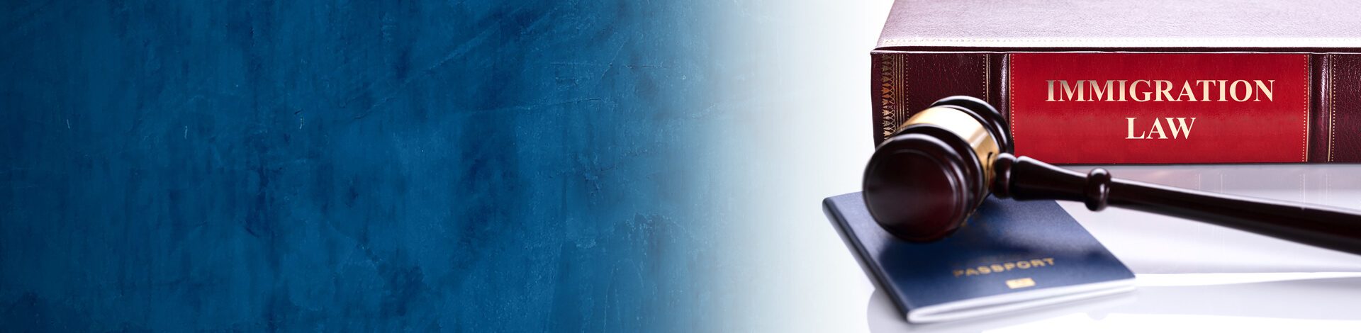 Law book and gavel on desk of immigration lawyer outlining National Interest Waiver (NIW) and Extraordinary Ability (EB-1A) immigrant green card and visa petitions.